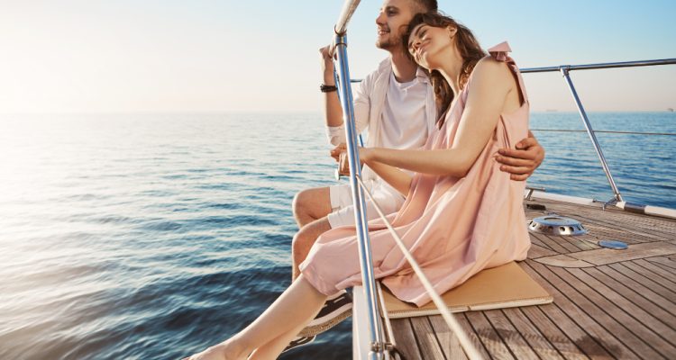 happy-beautiful-adult-couple-sitting-side-yacht-watching-seaside-hugging-while-vacation-tan-might-fade-such-memories-you-share-with-one-you-love-last-forever