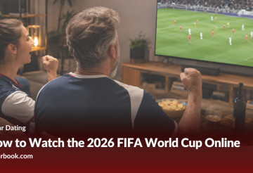 Couple cheer at a living room TV showing a soccer match; banner reads 'How to Watch the 2026 FIFA World Cup Online'.
